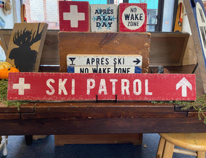 Large Ski Patrol Sign on Rustic Barnboard